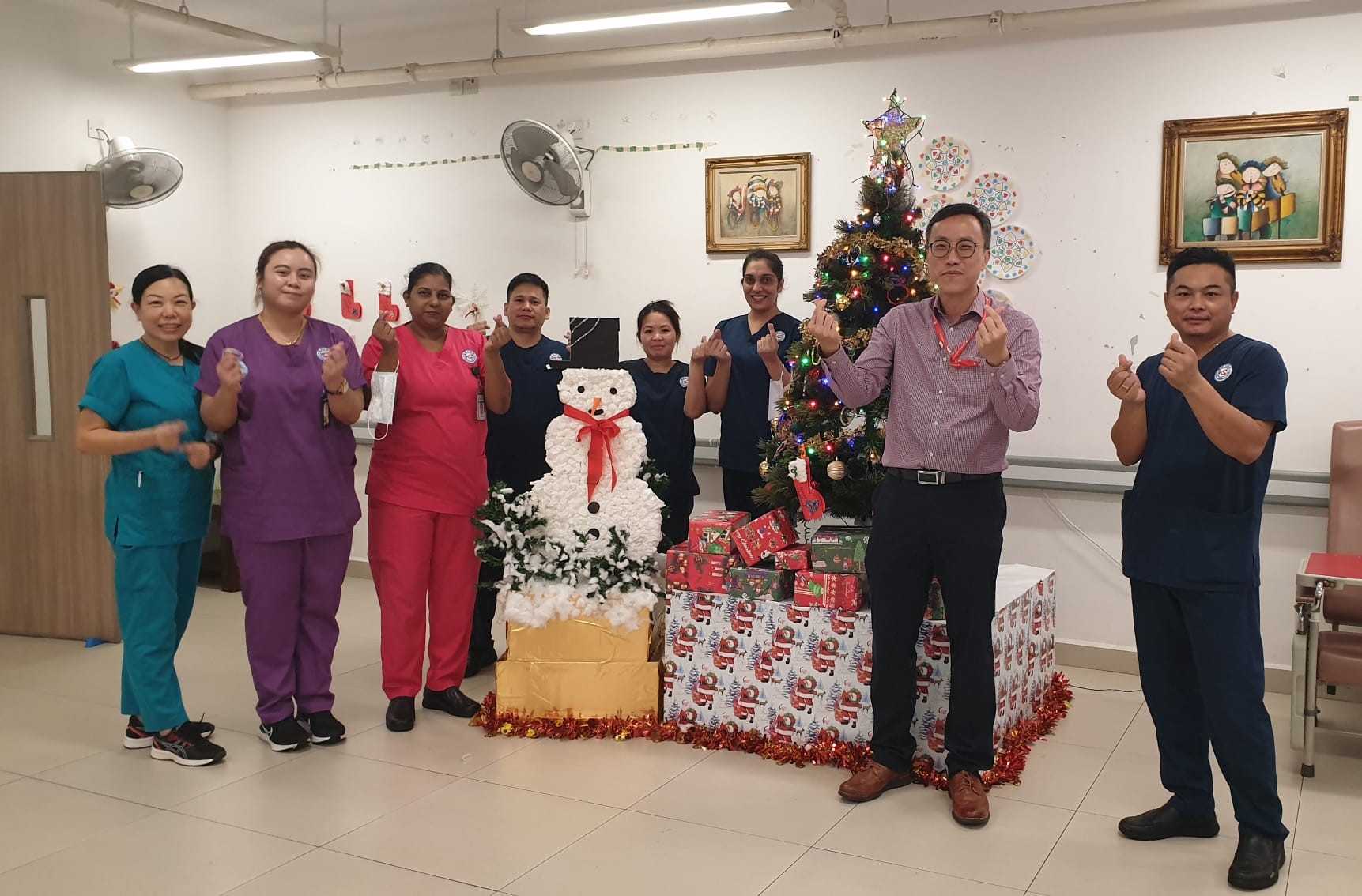 LTC (NS) Marcus Lee with colleagues at Thye Hua Kuan (THK) Nursing Home