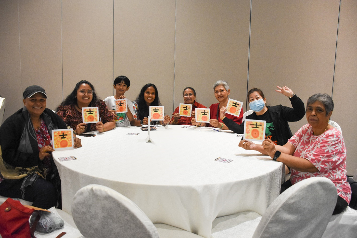 HomeTeamNS members with their Nagomi Art artworks.