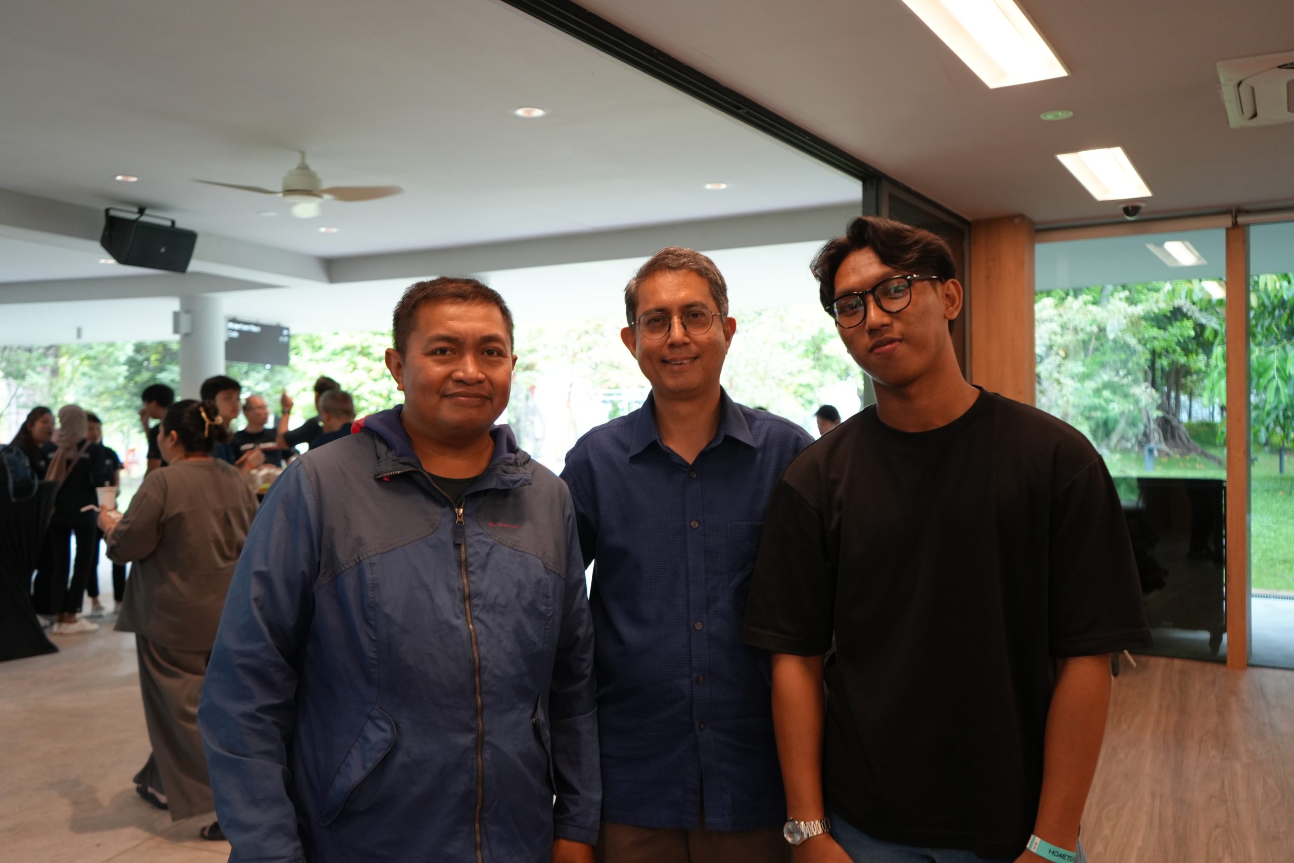 From left: Proud father Mr Abdul Halim Bin Dahlan; President of HomeTeamNS Mr Muhammad Faishal Ibrahim; HomeTeamNS Children's Education Awards 2023 recipient Muhammad Fatris Ihsan Bin Muhamad Hafizi.