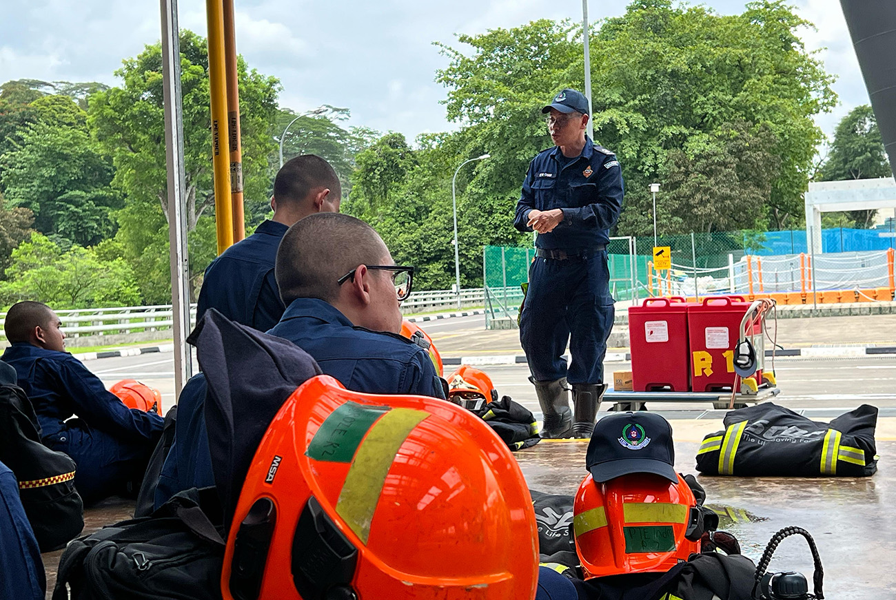 Kim Mun conducting a practical revision session for trainees ahead of their assessment.