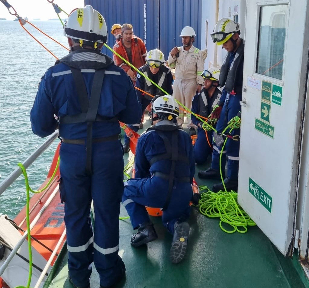 Naufal and his crew setting up the height rescue system. He was tasked with handling the casualty and safely transferring them from inside the vessel to the open deck.