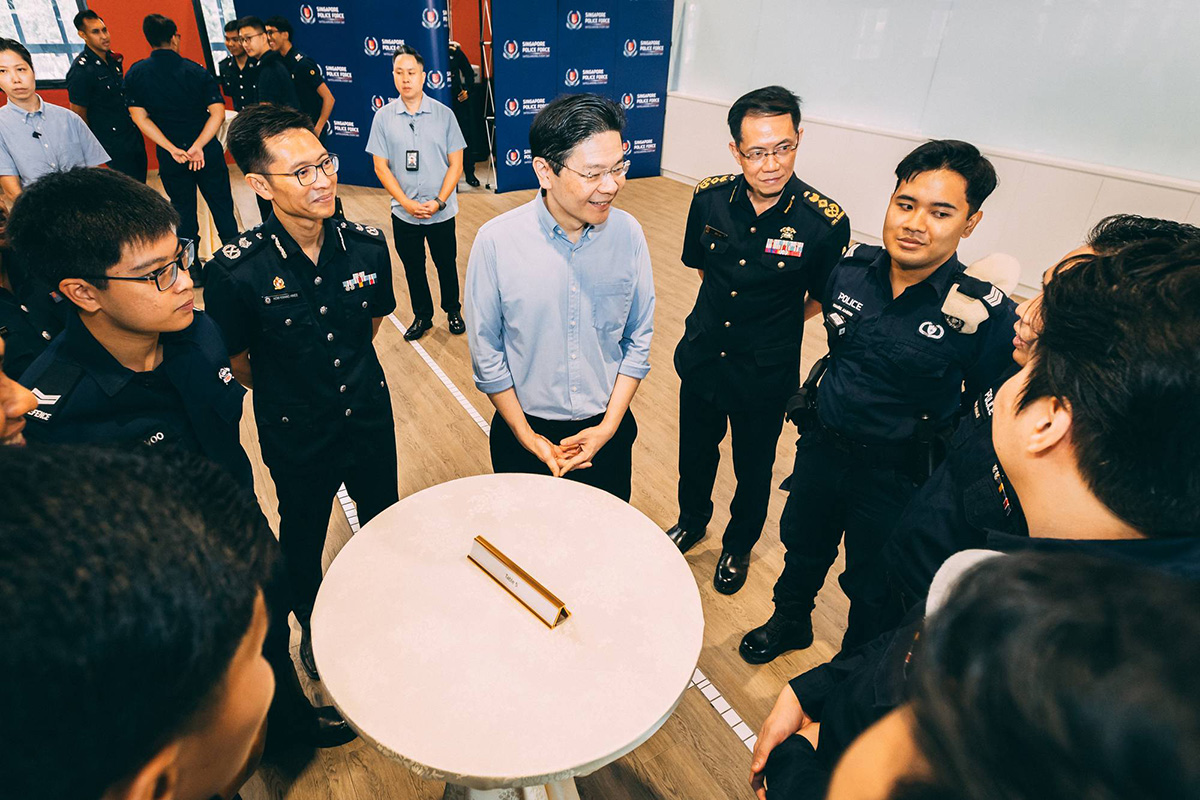 PM Wong engaging with NS officers from the SPF and SCDF.