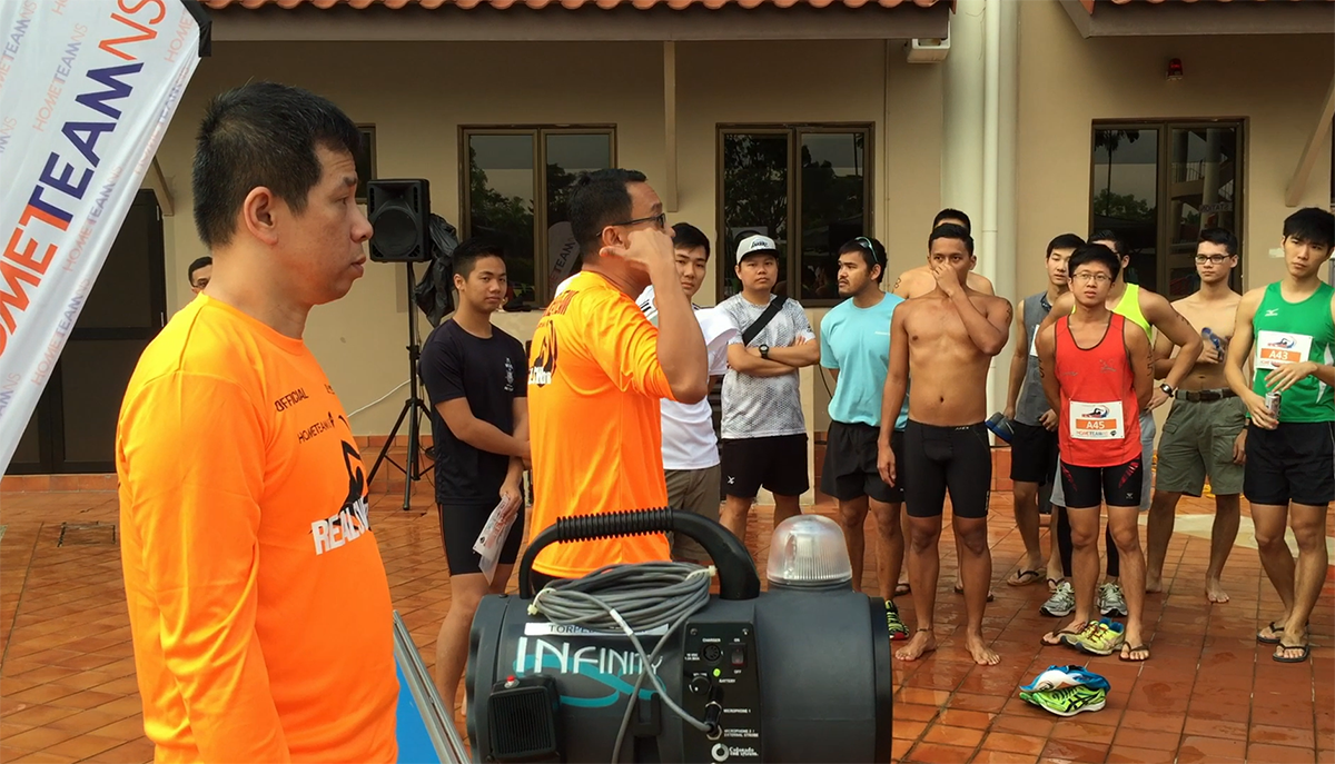 Lionel (left) during a briefing session at the first REAL® Swim on 20 August 2016.