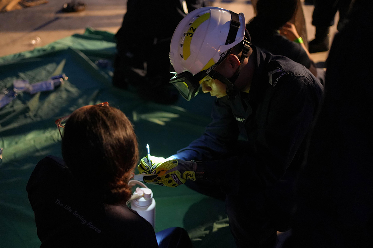 Anaqy (right) records vital triage information during a mass casualty exercise, conducted as the final exercise of the 25th Section Commander (Paramedic) Course.
