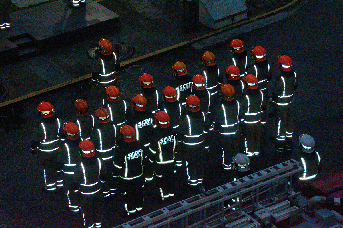As dawn breaks, the rota forms up for the flag-raising and scenario drill before completing their duty.