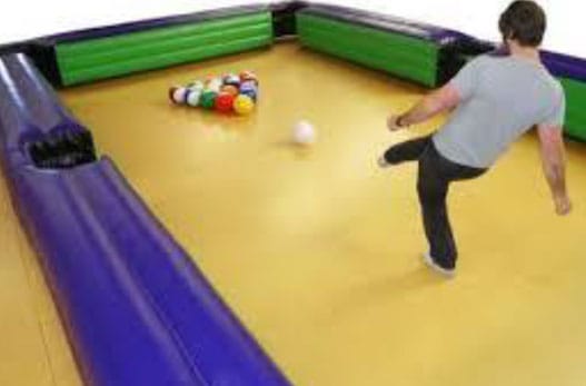 Image of a guy playing pool soccer
