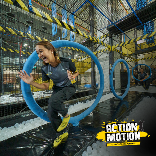 East Villa Corporate Sales 32 Team members racing through the Action Motion obstacle course at HomeTeamNS Bedok Reservoir.